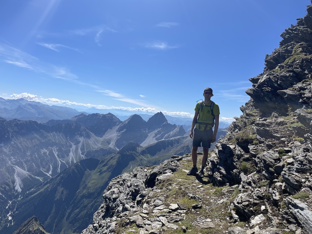 Julian posing for a picture while hiking on Habicht.